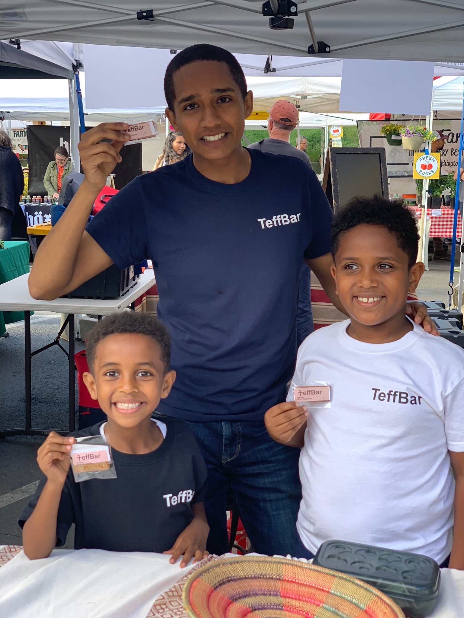 Sasu sharing TeffBar at a farmers market
